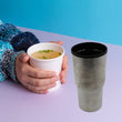 Double-walled stainless steel vacuum insulated coffee cup, travel mug without lid.