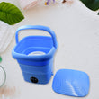 Foldable mini washing machine with drain basket, suitable for laundry and travel.