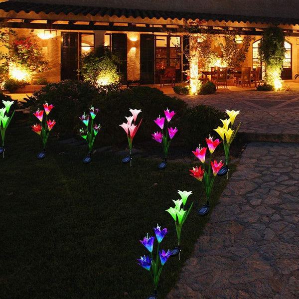 Solar lily flower stake lights, outdoor, glowing in garden