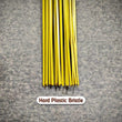 Hard bristle broom with plastic handle, close-up of bristles