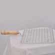 Barbecue grill with square stainless steel mesh and wooden handle.