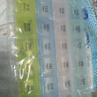 Transparent 7-day pill storage box with 4 rows for easy medication management.