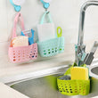 Adjustable plastic basket for kitchen sink, perfect for drainage and organizing small items.