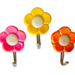 Colorful flower wall hooks for organizing small items.