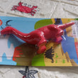 Red dinosaur shaped eraser