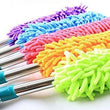 Microfiber duster with extendable handle for easy cleaning.