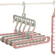 View of plastic hangers with nine holes and anti-slip feature.