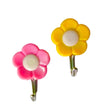 Pack of 5 adhesive flower-shaped hooks for wall decor.