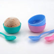 Snack set components laid out together: spoon, bowl, and dish.