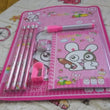 Wooden pencils and sharpener set for kids, includes eraser and diary.