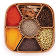 Multi-compartment masala box for organizing spices and herbs.