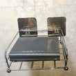 Stainless steel wall stand for securing set-top boxes.