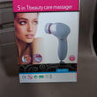 Pink 5-in-1 facial and body massager.