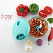 Hand-held vegetable chopper with stainless steel blades, detailed view.