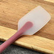 Close-up of the silicone spatula, highlighting its non-stick surface and color variety