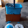 Spin mop with easy-wheels and large plastic bucket, ideal for floor cleaning