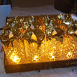 Collection of gold LED candles in various sizes, ideal for enhancing table settings and creating ambiance.