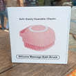 Massage bath body brush with silicone bristles and easy-to-use shampoo dispenser.