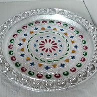 Silver plated pooja thali for religious ceremonies.