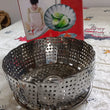 Stainless steel foldable basket for steaming and drying dishes.