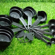 Plastic measuring cups and spoons set with a butterfly-shaped holder, highlighting its design