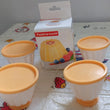 Set of pudding molds with covers for homemade desserts.