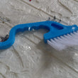 Hand-held cleaner for small gaps, useful for various household tasks.